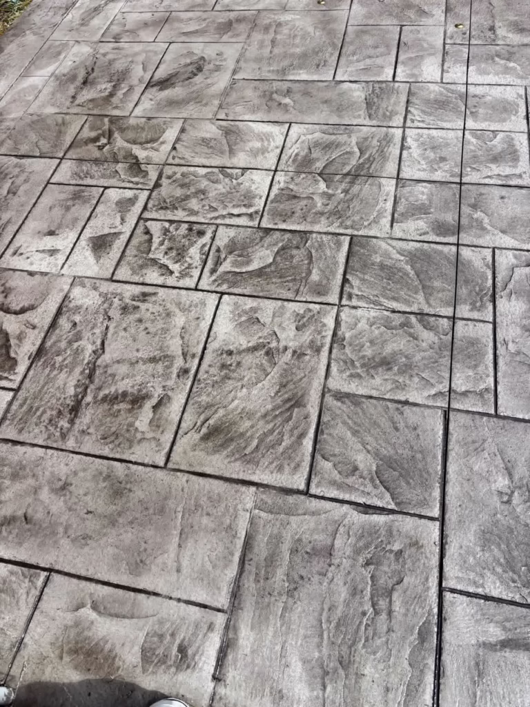 Close-up of stamped concrete pool deck texture