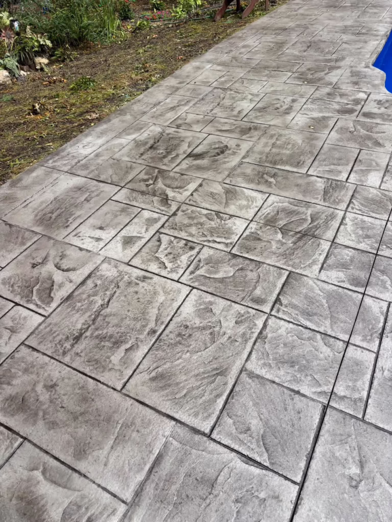 Stamped concrete pool deck walkway