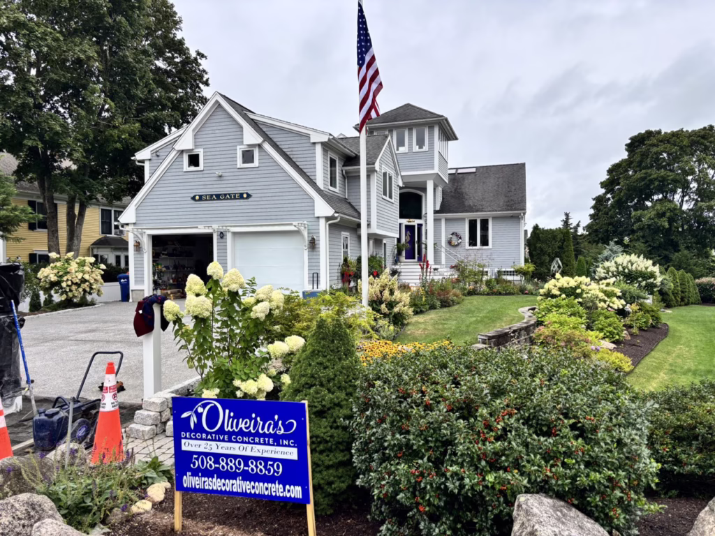 Oliveira’s Decorative Concrete job sign at the Sea Gate driveway project in Mattapoisett, MA
